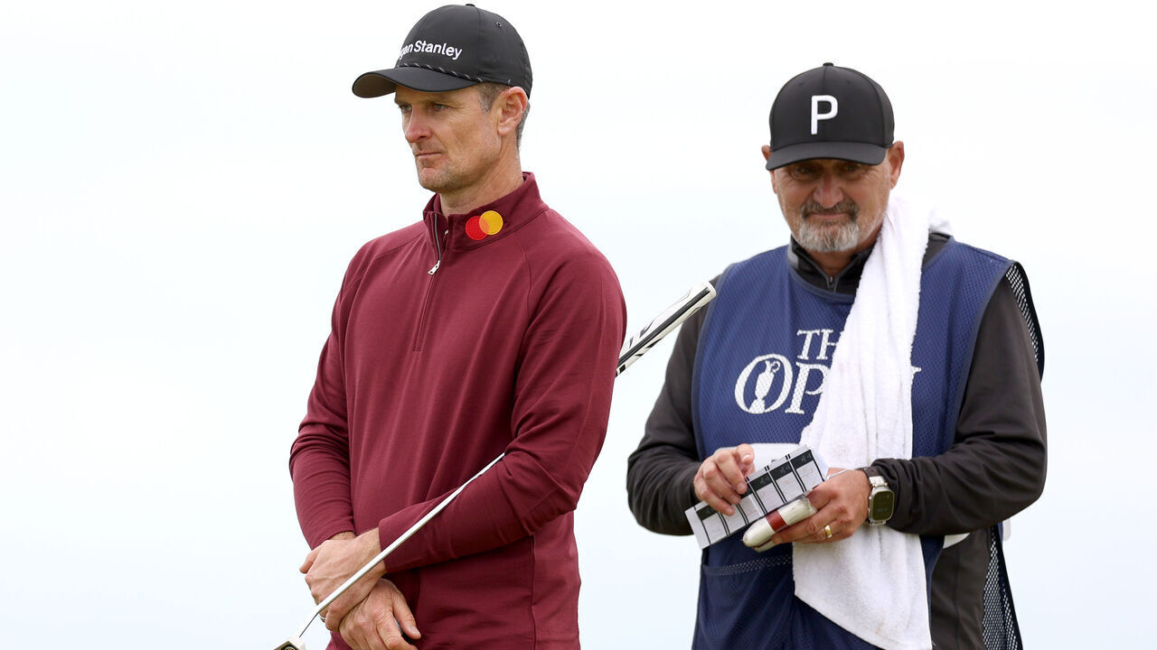 TROON, SCOTLAND - JULY 21: Justin Rose of England and his caddie Mark Fulcher look on from the 12th hole during day four of The 152nd Open championship at Royal Troon on July 21, 2024 in Troon, Scotland.