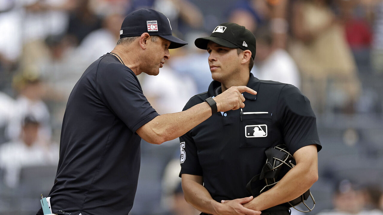 NEW YORK, NY - JULY 21: Aaron Boone #17 of the New York Yankees argues with home plate umpire Edwin Jimenez #75 during the sixth inning against the Tampa Bay Rays at Yankee Stadium on July 21, 2024 in New York City.