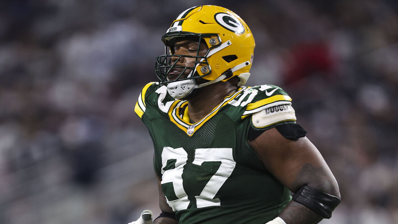 ARLINGTON, TX - JANUARY 14: Kenny Clark #97 of the Green Bay Packers runs across the field during an NFL wild-card playoff football game against the Dallas Cowboys at AT&T Stadium on January 14, 2024 in Arlington, Texas.