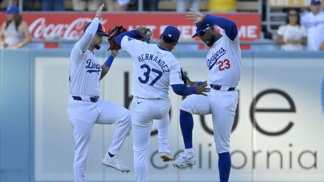 LOS ANGELES, CALIFORNIA - JULY 21: Andy Pages #44, Teoscar Hernandez #37 and Jason Heyward #23 of the Los Angeles Dodgers celebrate after the final out of the ninth inning against the Boston Red Sox at Dodger Stadium on July 21, 2024 in Los Angeles, California.