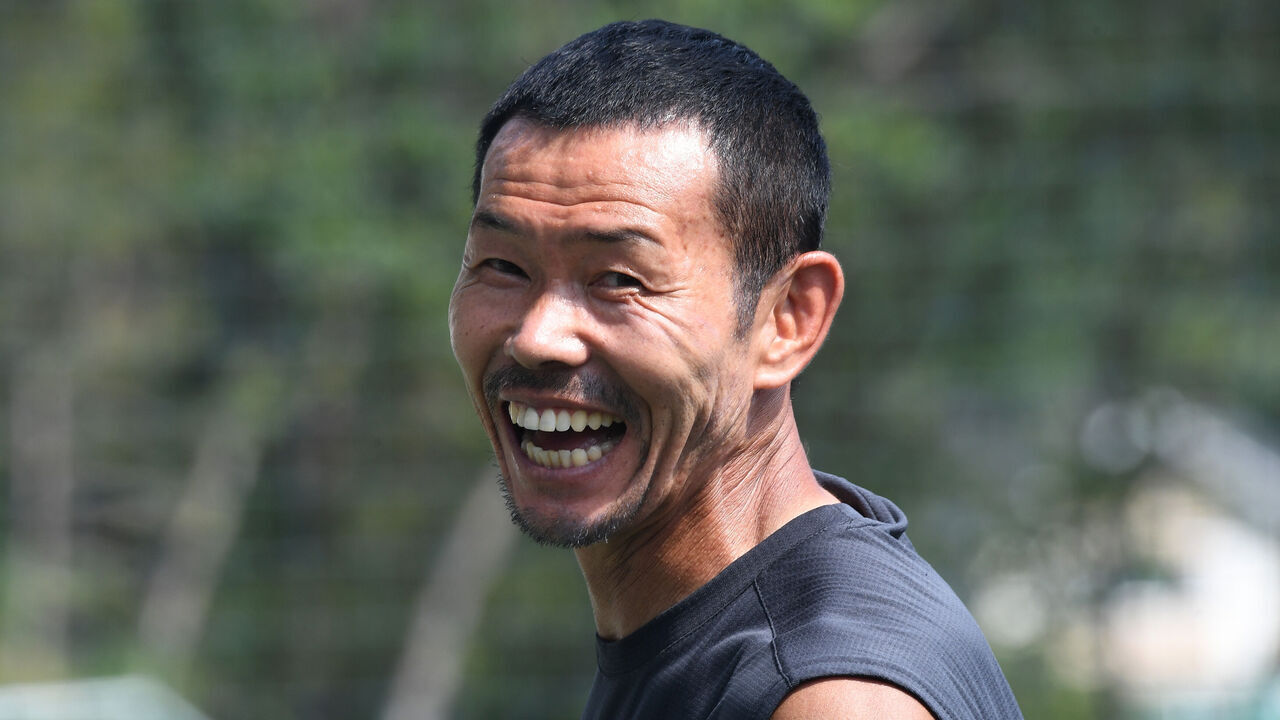 This picture taken on July 28, 2018 shows Son Woong-jung, father of South Korean football star Son Heung-min, smiling at his football academy in Chuncheon, 75 kilometres east of Seoul. - As Son Heung-min's career takes off in England, his legacy is already taking shape in South Korea -- at an innovative academy where ball control is king and shooting is frowned upon. The SON Football Academy in Son's native Chuncheon, run by his father Son Woong-jung, takes an unusual approach for Korean sports, where training is typically strenuous and young players practise for up to eight hours a day.