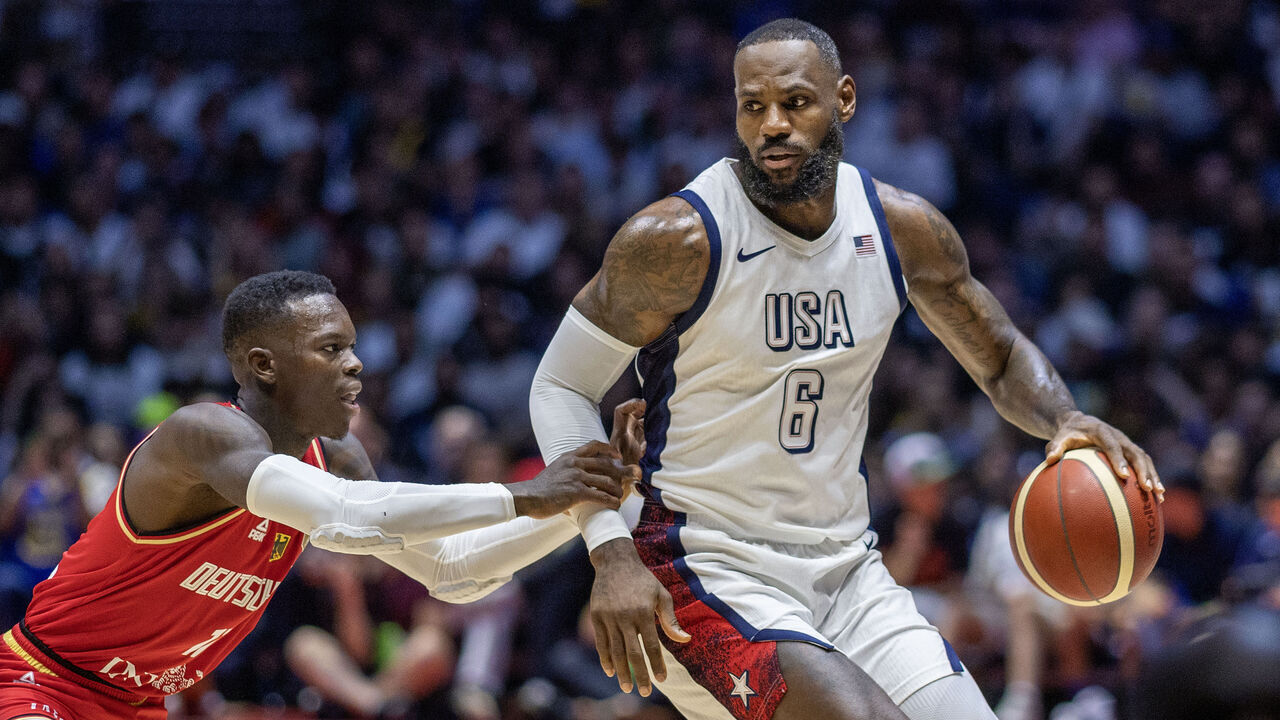 LONDON, ENGLAND: JULY 22: LeBron James #6 of the United States, defended by Dennis Schröder #17 of Germany during the USA V Germany, USA basketball showcase match in preparation for the Paris Olympic Games at The O2 Arena on July 22nd, 2024, in London, England.