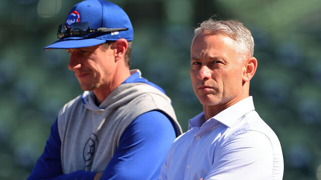 CHICAGO, ILLINOIS - MAY 22: Manager Craig Counsell #30 of the Chicago Cubs talks with President Jed Hoyer during batting practice prior to the game against the Atlanta Braves at Wrigley Field on May 22, 2024 in Chicago, Illinois.