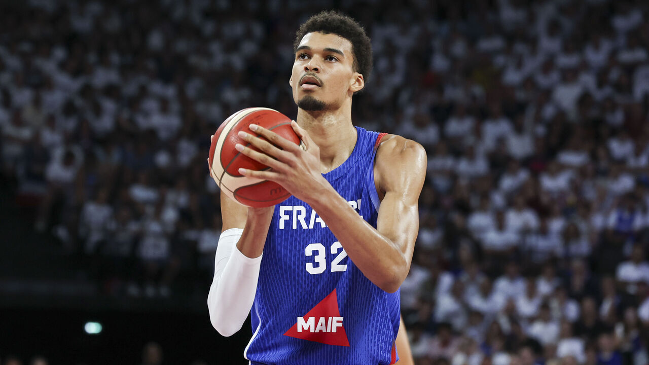LYON, FRANCE - JULY 12: Victor Wembanyama #32 of France shoots a free throw during the friendly match between France and Serbia at LDLC Arena on July 12, 2024 in Lyon, France.