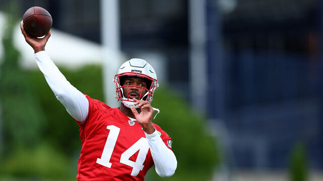 FOXBOROUGH, MASSACHUSETTS - MAY 29: Jacoby Brissett #14 of the New England Patriots makes a pass during the New England Patriots OTA Offseason Workout on May 29, 2024 in Foxborough, Massachusetts.