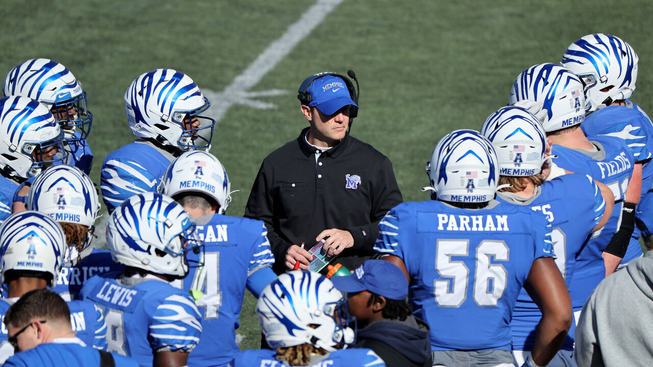 MEMPHIS, TN - NOVEMBER 13: Ryan Silverfield, head coach of the Memphis Tigers talks to his team during a timeout against the East Carolina Pirates on November 13, 2021 at Liberty Bowl Memorial Stadium in Memphis, Tennessee.