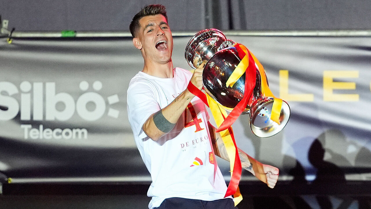 MADRID, SPAIN - 2024/07/15: Spanish player Alvaro Morata seen raising the trophy during the celebration of the Spanish national football team for the victory of the UEFA Euro 2024 title at Plaza de Cibeles. The final match was Spain against England and Spain defeated England 2-1.