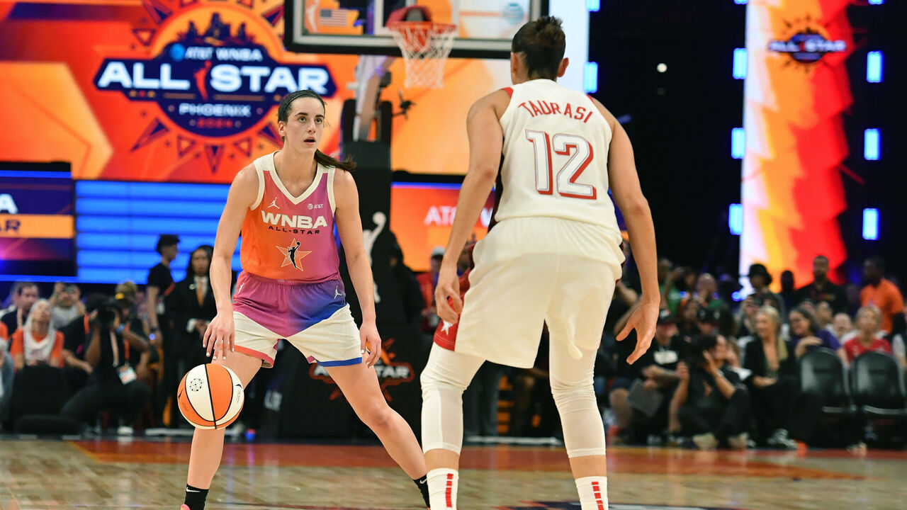 PHOENIX, AZ - JULY 20: Caitlin Clark #22 of Team WNBA dribbles the ball during the 2024 WNBA All Star Game on July 20, 2024 at Footprint Center in Phoenix, Arizona. Mandatory Copyright Notice: Copyright 2024 NBAE