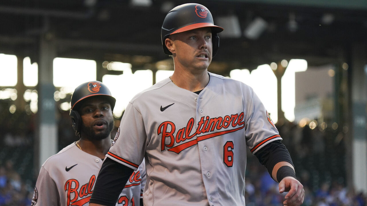 CHICAGO, ILLINOIS - JULY 13: Cedric Mullins #31 and Ryan Mountcastle #6 of the Baltimore Orioles scored during the first inning of a game against the Chicago Cubs at Wrigley Field on July 13, 2022 in Chicago, Illinois.