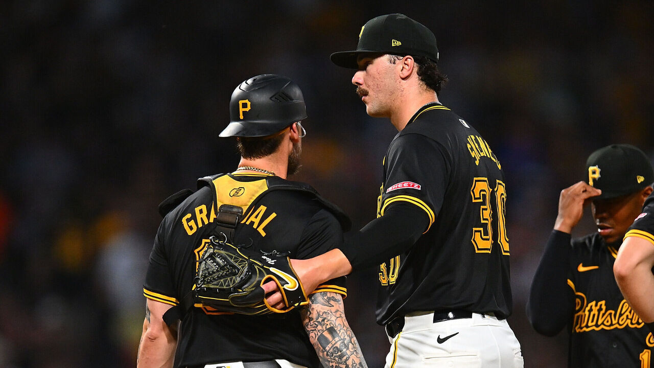 PITTSBURGH, PENNSYLVANIA - JULY 23: Pitcher Paul Skenes #30 of the Pittsburgh Pirates talks with catcher Yasmani Grandal #6 while being removed from the game in the ninth inning against the St. Louis Cardinals at PNC Park on July 23, 2024 in Pittsburgh, Pennsylvania.