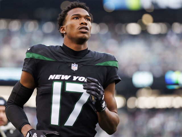 EAST RUTHERFORD, NEW JERSEY - NOVEMBER 24: Garrett Wilson #17 of the New York Jets runs onto the field during player introductions before an NFL football game against the Miami Dolphins at MetLife Stadium on November 24, 2023 in East Rutherford, New Jersey.