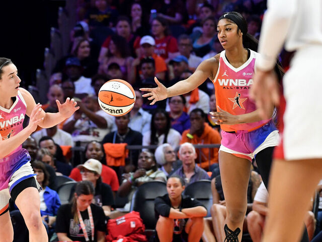 PHOENIX, AZ - JULY 20: Angel Reese #5 bases the ball to Caitlin Clark #22 of Team WNBA during the 2024 WNBA All Star Game on July 20, 2024 at Footprint Center in Phoenix, Arizona. Mandatory Copyright Notice: Copyright 2024 NBAE