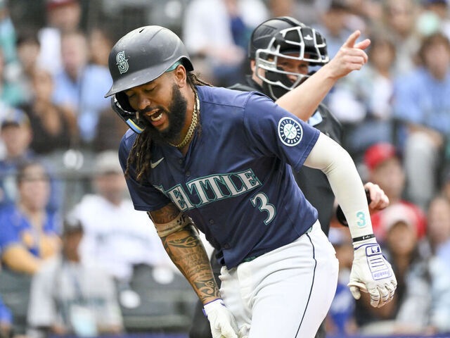 SEATTLE, WASHINGTON - JULY 22: J.P. Crawford #3 of the Seattle Mariners reacts to being hit by a pitch during the first inning against the Los Angeles Angels at T-Mobile Park on July 22, 2024 in Seattle, Washington.
