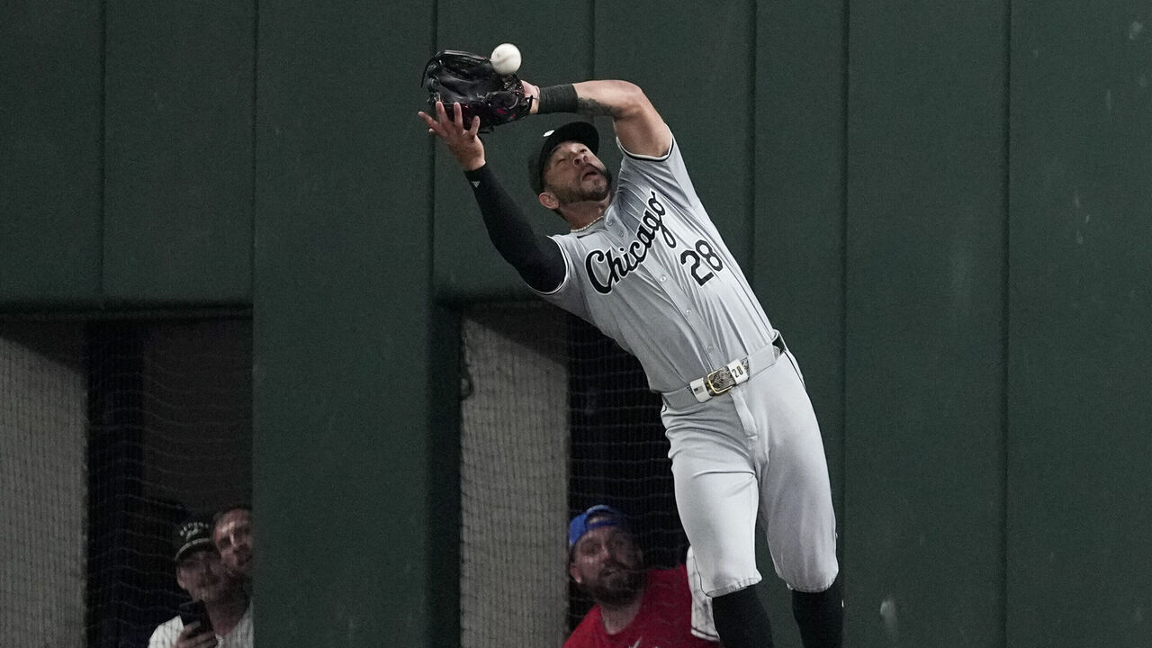 ARLINGTON, TEXAS - JULY 24: Tommy Pham #28 of the Chicago White Sox catches a fly ball hit by Josh Smith #8 of the Texas Rangers during the eighth inning at Globe Life Field on July 24, 2024 in Arlington, Texas.