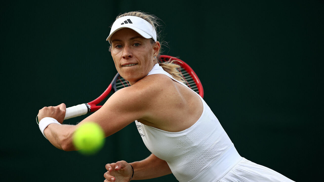 Germany's Angelique Kerber returns against Kazakhstan's Yulia Putintseva during their women's singles tennis match on the second day of the 2024 Wimbledon Championships at The All England Lawn Tennis and Croquet Club in Wimbledon, southwest London, on July 2, 2024.