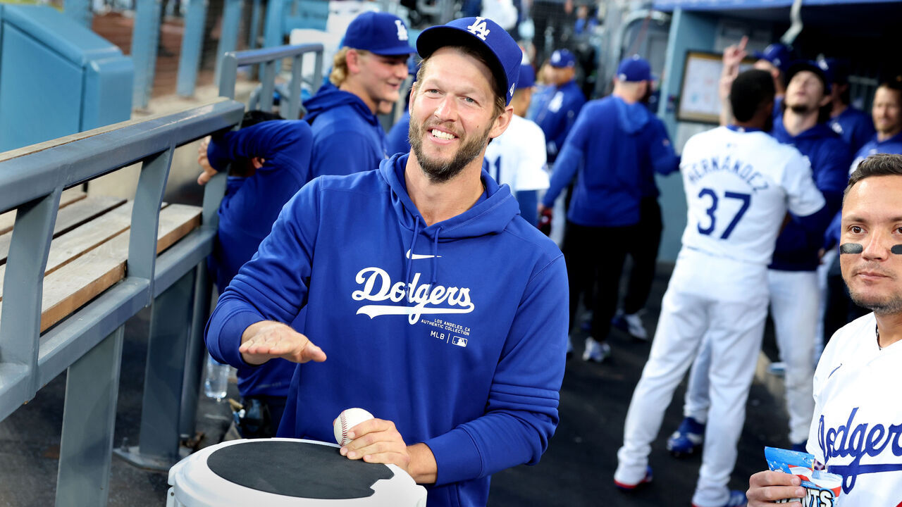 LOS ANGELES, CALIFORNIA - APRIL 16: Dodgers pitcher Clayton Kershaw has fun in the dugout before a game against the Nationals at Dodger Stadium Tuesday. (Wally Skalij/Los Angeles Times via Getty Images)