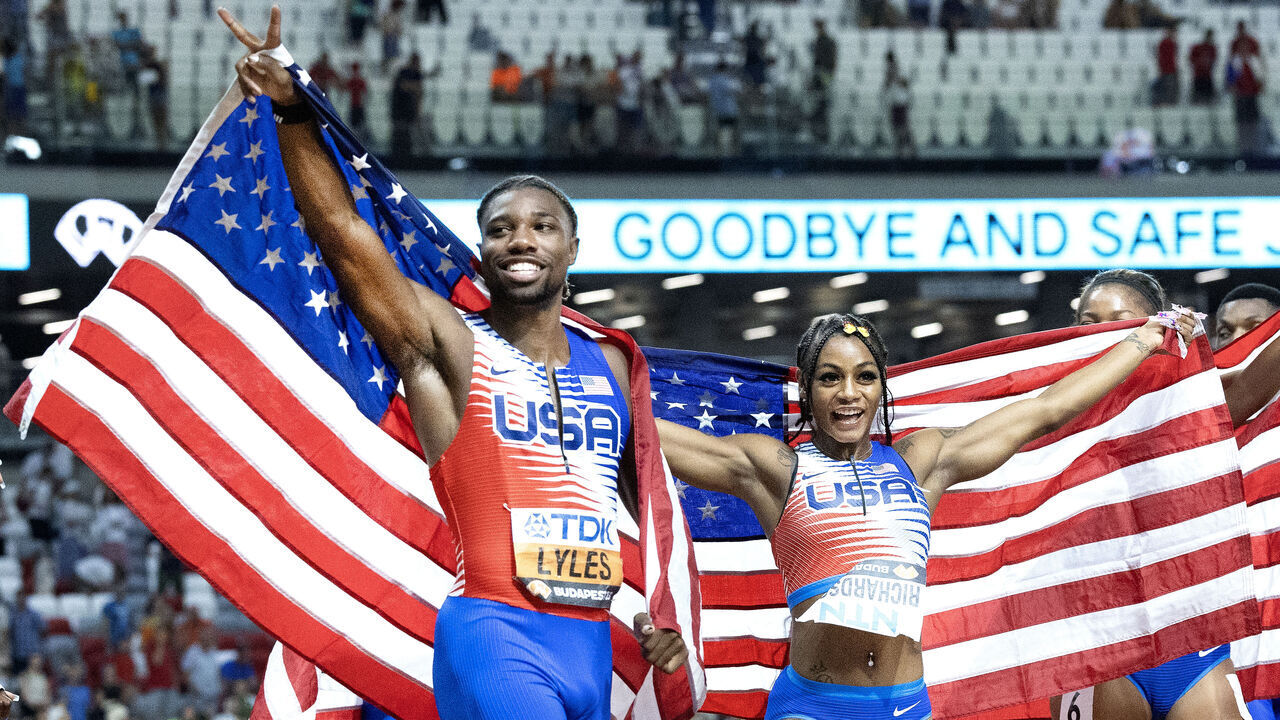 BUDAPEST, HUNGARY: August 26: Noah Lyles of the United States and Sha'Carri Richardson of the United States celebrates the team's gold medal wins with teammates after the Women's and Men's 4x100m Relay Finals during the World Athletics Championships, at the National Athletics Centre on August 26th, 2023 in Budapest, Hungary.