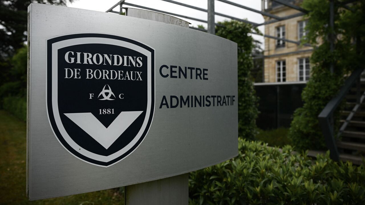This general view taken on May 19, 2022, shows a sign with a logo in front of the chateau of FC Girondins de Bordeaux at the club's training ground in Le Haillan, near Bordeaux, south-western France.