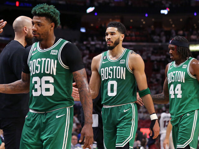 Miami, FL - May 23: Boston Celtics, from left, Marcus Smart, Jayson Tatum and Robert Williams III head to the bench in the fourth quarter. The Celtics beat the Miami Heat, 116-99, in Game 4 of the 2023 Eastern Conference Finals.