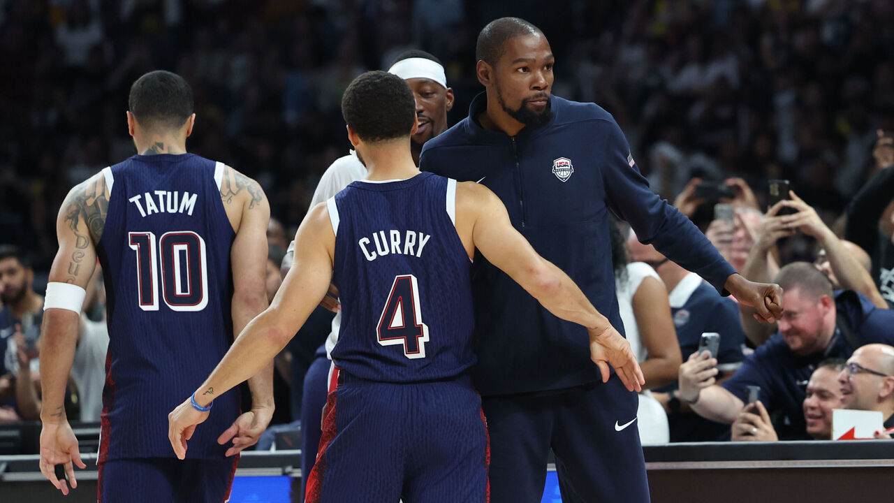 ABU DHABI, UAE - JULY 15: Stephen Curry #4 and Kevin Durant #7 of Team USA embrace during the game against the Australian Basketball Men's Team during the 2024 USA Basketball Showcase on July 15, 2024 in Abu Dhabi, The United Arab Emirates at Etihad Arena. NOTE TO USER: User expressly acknowledges and agrees that, by downloading and/or using this Photograph, user is consenting to the terms and conditions of the Getty Images License Agreement. Mandatory Copyright Notice: Copyright 2024 NBAE