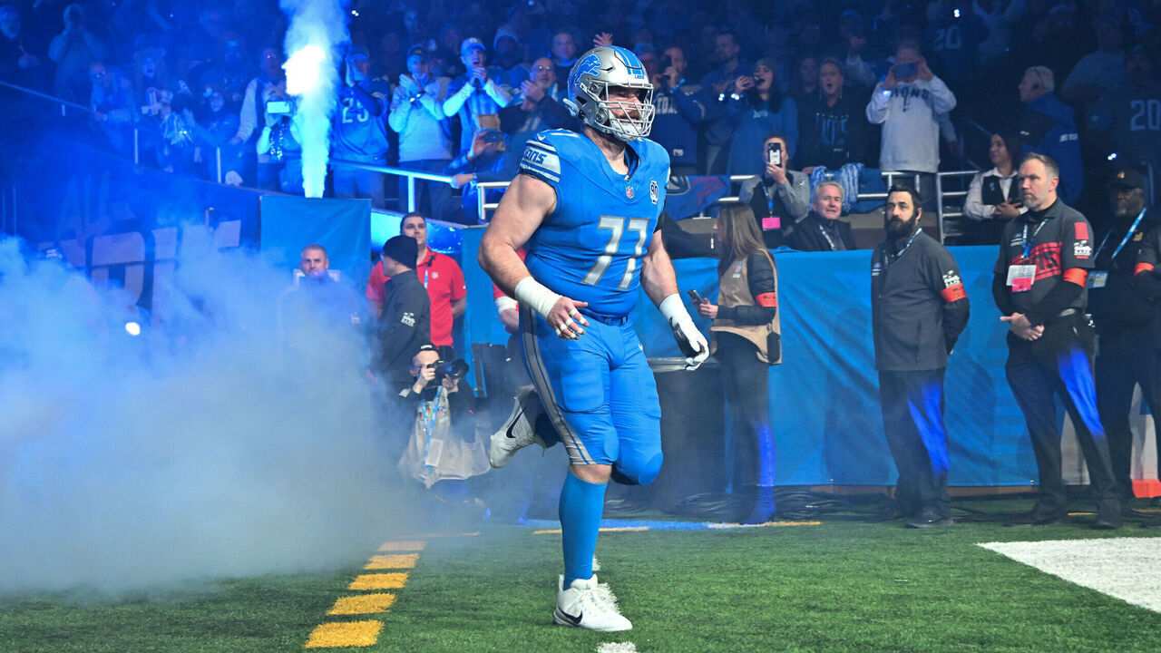 DETROIT, MI - JANUARY 14: Detroit Lions center Frank Ragnow (77) is introduced during pregame ceremonies prior to the NFC Wild Card game between the Detroit Lions and the Los Angeles Rams game on Sunday January 14, 2023 at Ford Field in Detroit, MI.