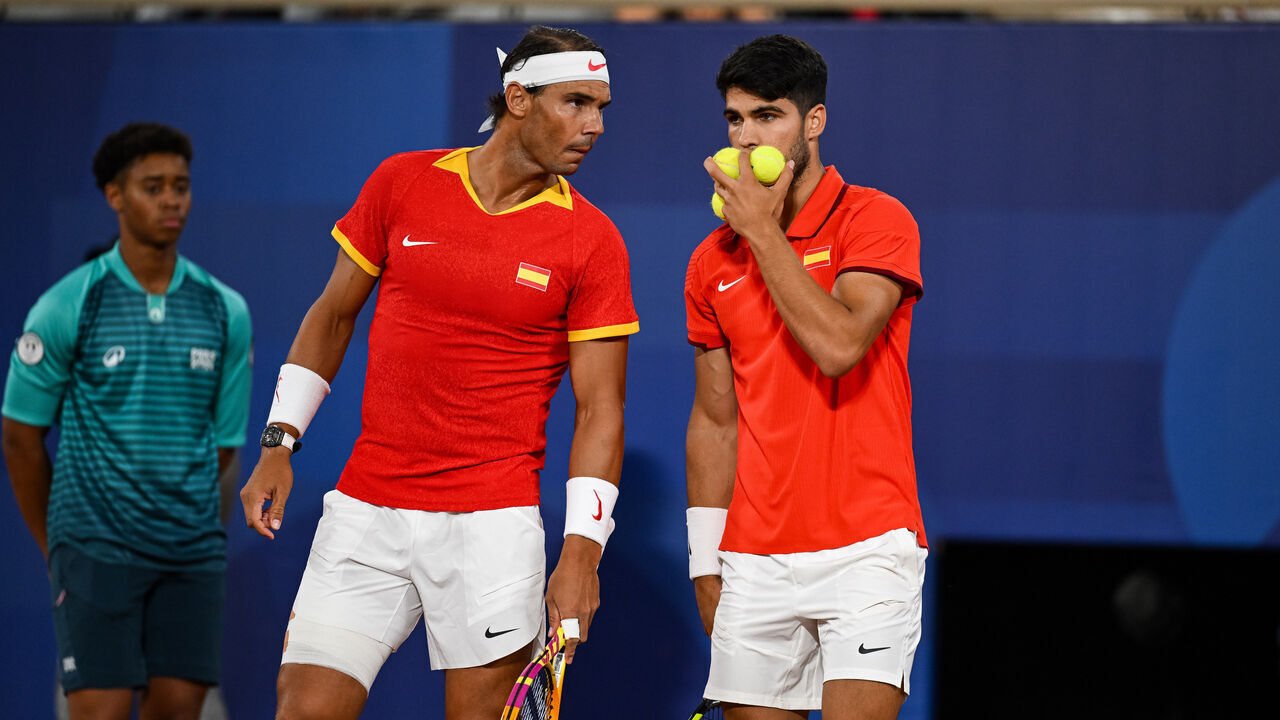 PARIS, FRANCE - JULY 27: Rafael Nadal (L) and partner Carlos Alcaraz of Spain interact against Andres Molteni and Maximo Gonzalez of Argentina during the Men's Doubles first round match on day one of the Olympic Games Paris 2024 at Roland Garros on July 27, 2024 in Paris, France.