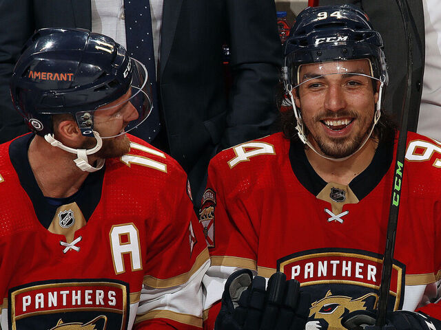 SUNRISE, FL - MARCH 3: Jonathan Huberdeau #11 and teammate Ryan Lomberg #94 of the Florida Panthers enjoy each others company between shifts against the Ottawa Senators at the FLA Live Arena on March 3, 2022 in Sunrise, Florida.