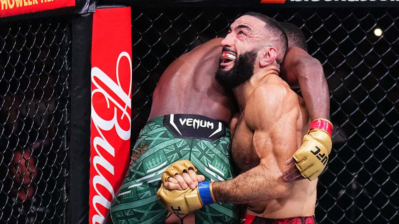 MANCHESTER, ENGLAND - JULY 27: (R-L) Belal Muhammad takes down Leon Edwards of Jamaica in the UFC welterweight championship bout during the UFC 304 event at Co-op Live on July 27, 2024 in Manchester, England.