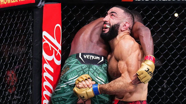 MANCHESTER, ENGLAND - JULY 27: (R-L) Belal Muhammad takes down Leon Edwards of Jamaica in the UFC welterweight championship bout during the UFC 304 event at Co-op Live on July 27, 2024 in Manchester, England.