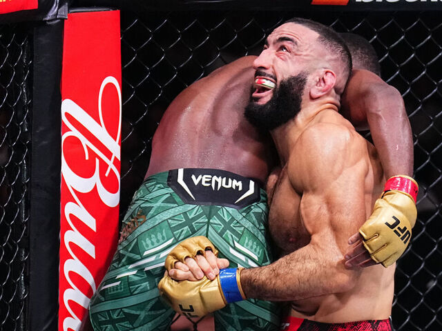 MANCHESTER, ENGLAND - JULY 27: (R-L) Belal Muhammad takes down Leon Edwards of Jamaica in the UFC welterweight championship bout during the UFC 304 event at Co-op Live on July 27, 2024 in Manchester, England.