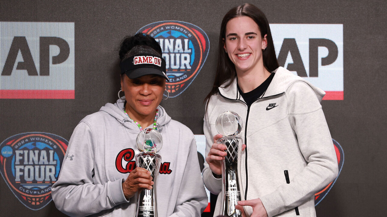 CLEVELAND, OHIO - APRIL 04: AP Coach of the Year Dawn Staley of the South Carolina Gamecocks and AP Player of the Year Caitlin Clark #22 of the Iowa Hawkeyes pose during the award press conference ahead of the 2024 NCAA Women's Basketball Tournament Final Four at Rocket Mortgage Fieldhouse on April 04, 2024 in Cleveland, Ohio.