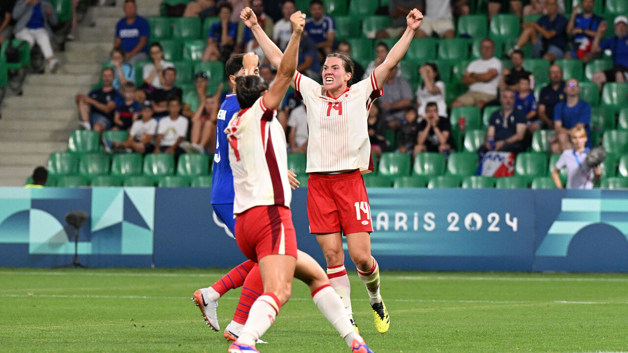 SAINT-ETIENNE, FRANCE - JULY 28: Vanessa Gilles #14 of Team Canada celebrates scoring her team's second goal during the Women's group A match between France and Canada during the Olympic Games Paris 2024 at Stade Geoffroy-Guichard on July 28, 2024 in Saint-Etienne, France.
