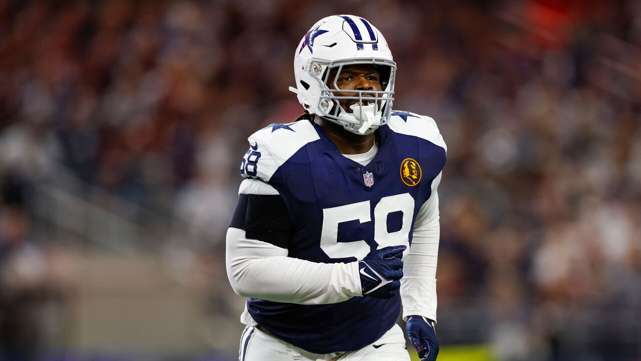 ARLINGTON, TEXAS - NOVEMBER 23: Mazi Smith #58 of the Dallas Cowboys runs towards the sideline against the Washington Commanders during the second half at AT&T Stadium on November 23, 2023 in Arlington, Texas.