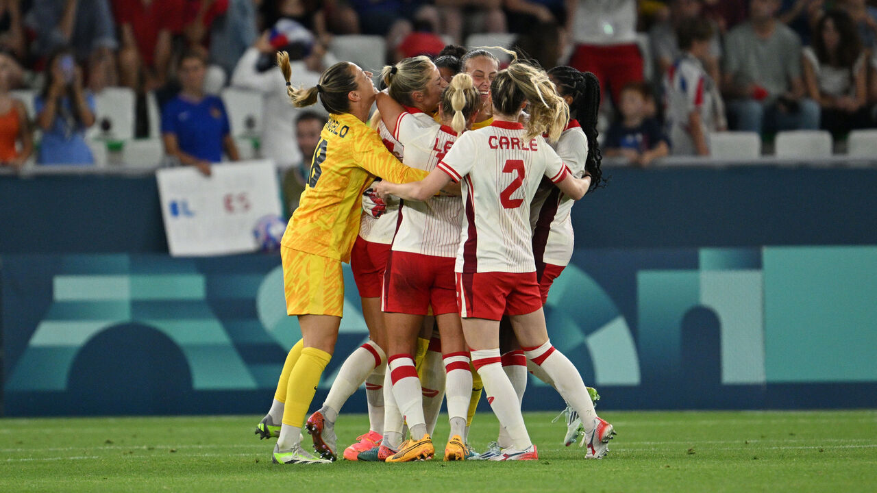 SAINT-ETIENNE, FRANCE - JULY 28: Players of Team Canada celebrate after the teams victory following the Women's group A match between France and Canada during the Olympic Games Paris 2024 at Stade Geoffroy-Guichard on July 28, 2024 in Saint-Etienne, France.
