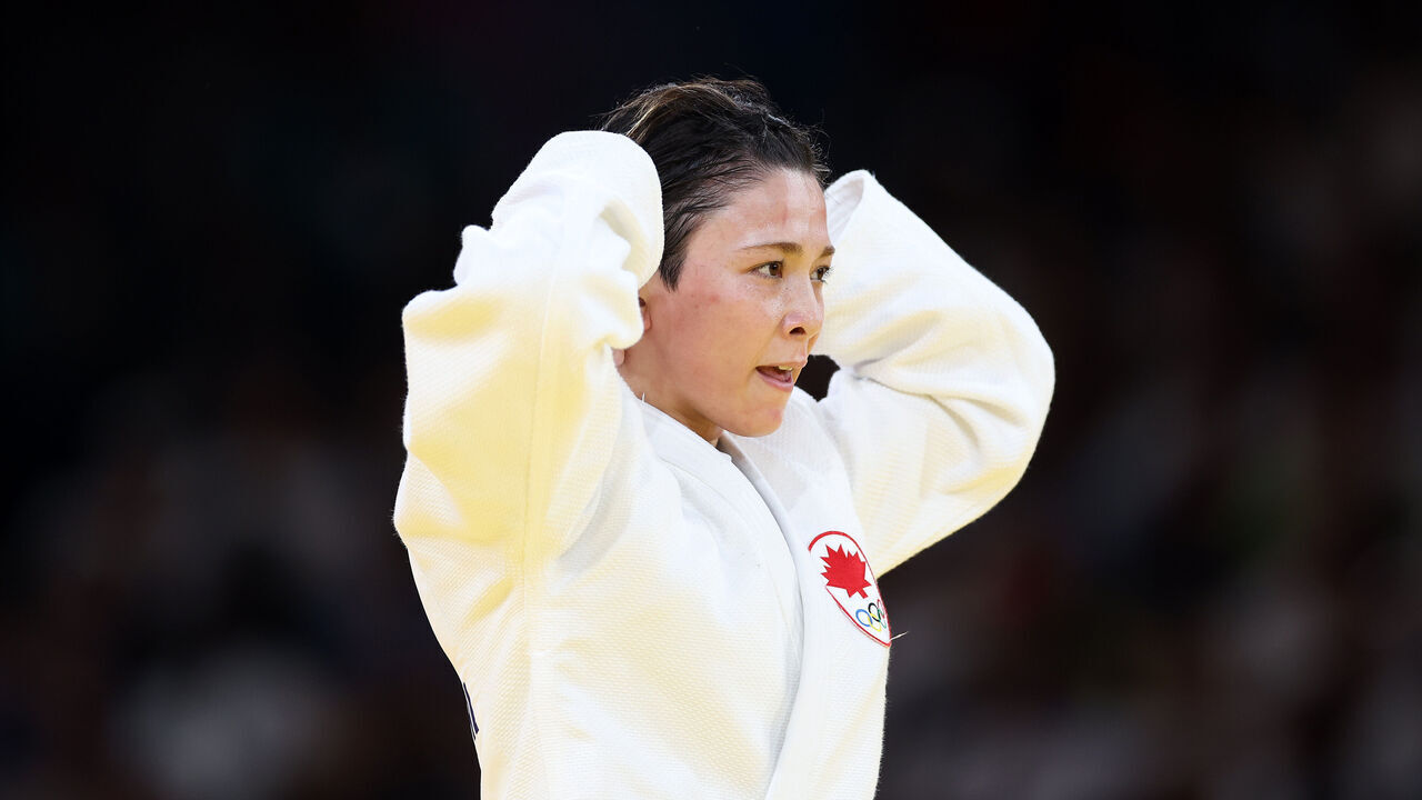 PARIS, FRANCE - JULY 29: Christa Deguchi (White) of Team Canada celebrates winning gold against Mimi Huh (Blue) of Team Republic of Korea following the Judo Women’s -57 kg Final contest on day three of the Olympic Games Paris 2024 at Champs-de-Mars Arena on July 29, 2024 in Paris, France.