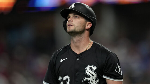 ARLINGTON, TEXAS - JULY 23: Andrew Benintendi #23 of the Chicago White Sox reacts after striking out during the first inning against the Texas Rangers at Globe Life Field on July 23, 2024 in Arlington, Texas.