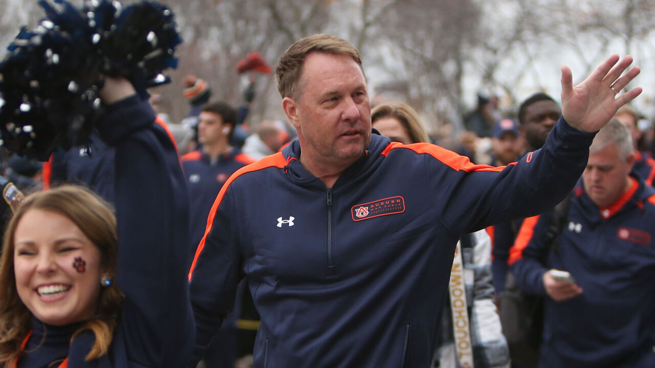 NASHVILLE, TN - DECEMBER 30: Auburn Tigers head coach Hugh Freeze waves during the Tiger Walk prior to the TransPerfect Music City Bowl between the Auburn Tigers and Maryland Terrapins, December 30, 2023 at Nissan Stadium in Nashville, Tennessee.