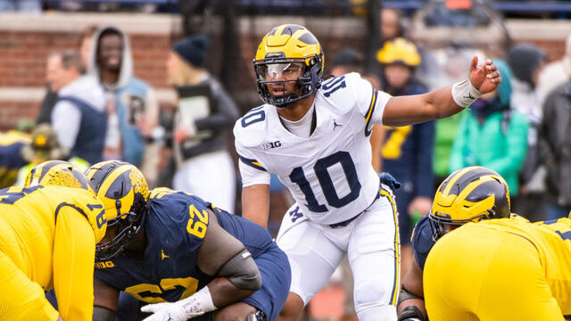 ANN ARBOR, MICHIGAN - APRIL 20: Alex Orji #10 of the Michigan Wolverines prepares to take the sna during the Spring Football Game at Michigan Stadium on April 20, 2024 in Ann Arbor, Michigan.