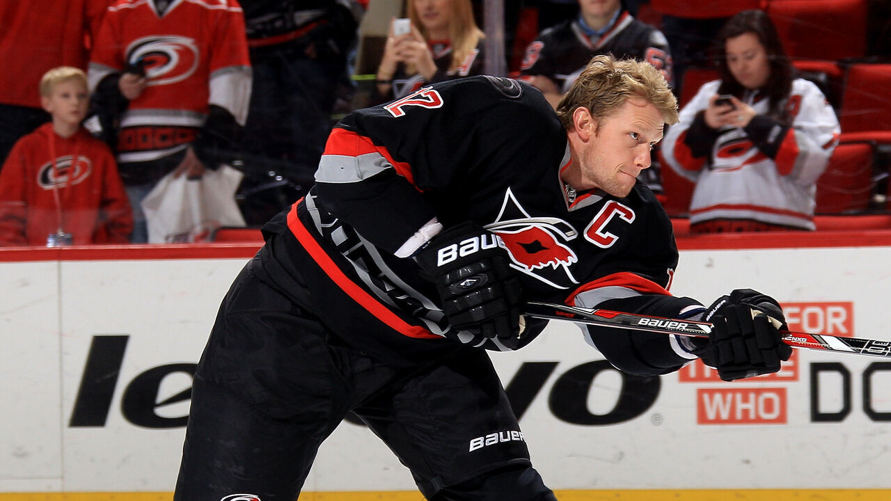 RALEIGH, NC - FEBRUARY 07: Eric Staal #12 of the Carolina Hurricanes shoots the puck during warmups prior to their NHL game against the Florida Panthers at PNC Arena on February 7, 2014 in Raleigh, North Carolina.