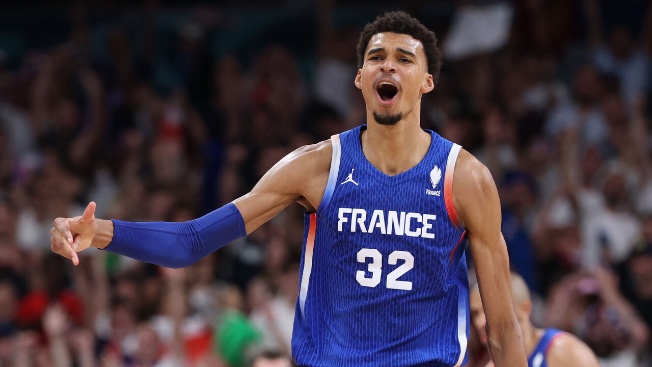 LILLE, FRANCE - JULY 30: Victor Wembanyama #32 of Team France reacts after making a three point basket during a Men's Group Phase-Group B match between Japan and France on day four of the Olympic Games Paris 2024 at Stade Pierre Mauroy on July 30, 2024 in Lille, France.