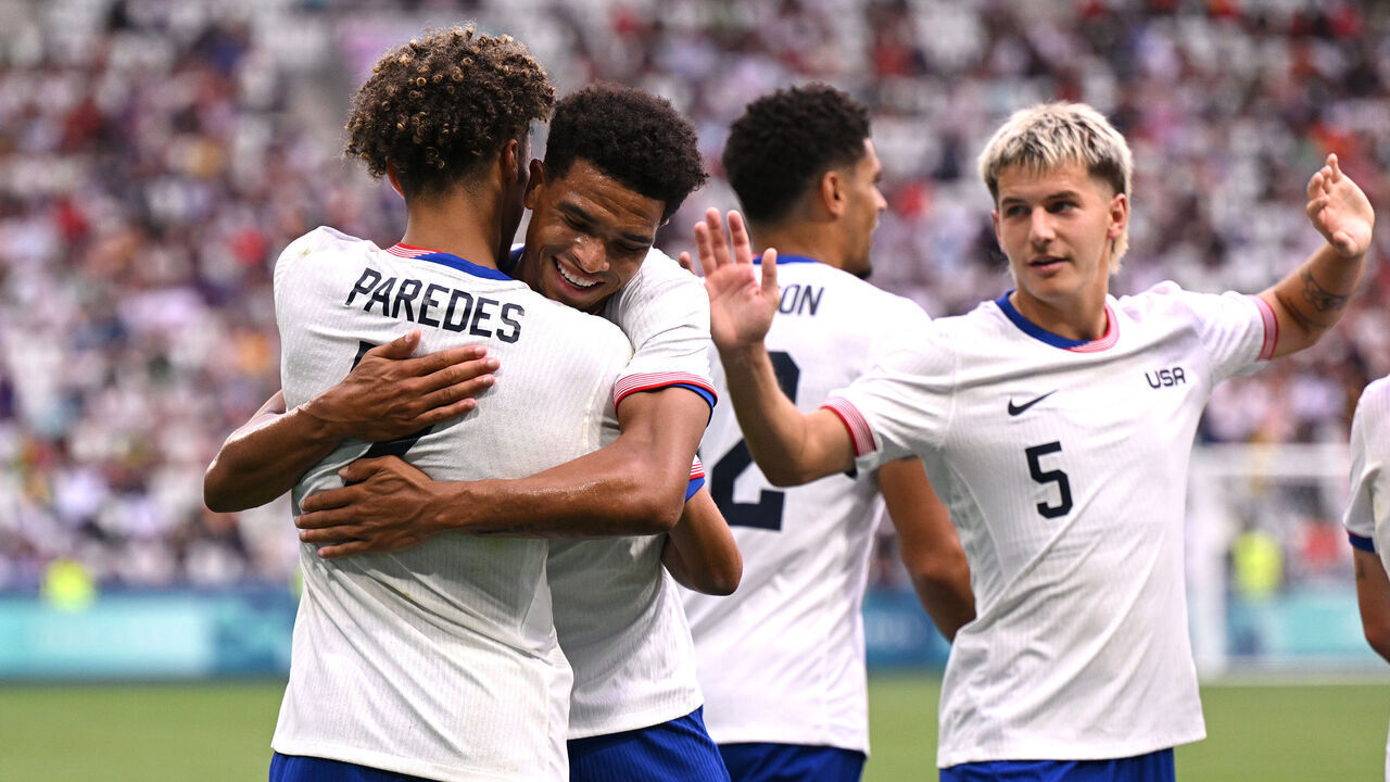 SAINT-ETIENNE, FRANCE - JULY 30: Kevin Paredes #7 of Team USA celebrates with teammates scoring his team's second goal during the Men's group A match between United States and Guinea during the Olympic Games Paris 2024 at Stade Geoffroy-Guichard on July 30, 2024 in Saint-Etienne, France.