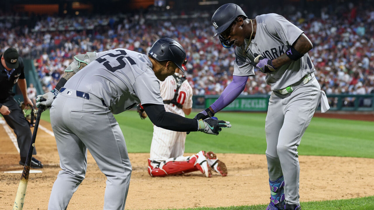 PHILADELPHIA, PENNSYLVANIA - JULY 30: Jazz Chisholm Jr. #13 of the New York Yankees celebrates with Gleyber Torres #25 after hitting a home run against the Philadelphia Phillies in the sixth inning at Citizens Bank Park on July 30, 2024 in Philadelphia, Pennsylvania.