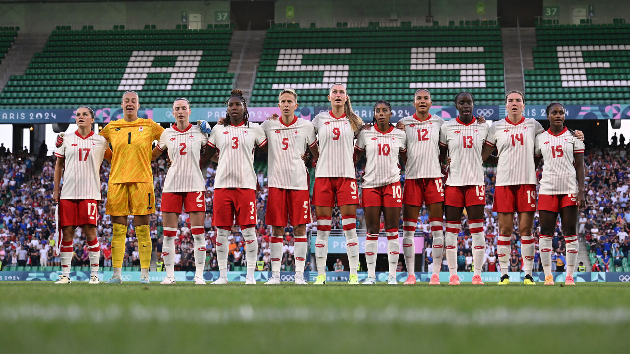 SAINT-ETIENNE, FRANCE - JULY 28: Team Canada sing their national anthem on pitch ahead of the Women's group A match between France and Canada during the Olympic Games Paris 2024 at Stade Geoffroy-Guichard on July 28, 2024 in Saint-Etienne, France.