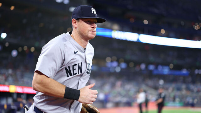 TORONTO, ON - JUNE 29: DJ LeMahieu #26 of the New York Yankees runs onto the field for warmup prior to a game against the Toronto Blue Jays at Rogers Centre on June 29, 2024 in Toronto, Ontario, Canada.