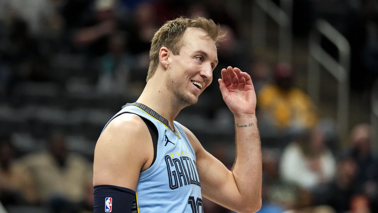 DETROIT, MICHIGAN - APRIL 01: Luke Kennard #10 of the Memphis Grizzlies reacts and smiles against the Detroit Pistons at Little Caesars Arena on April 01, 2024 in Detroit, Michigan.