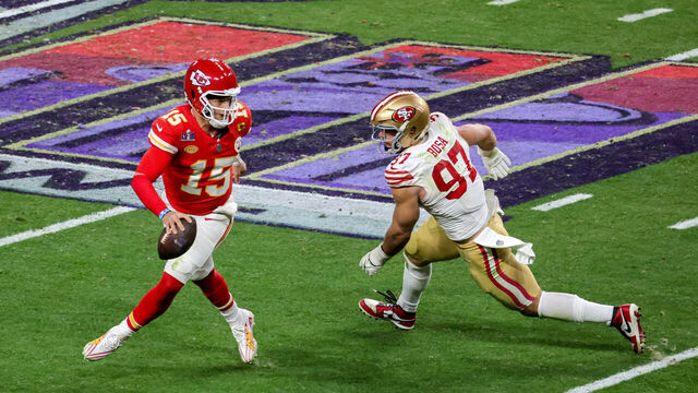 LAS VEGAS, NEVADA - FEBRUARY 11: Quarterback Patrick Mahomes #15 of the Kansas City Chiefs looks to throw under pressure from defensive end Nick Bosa #97 of the San Francisco 49ers in the fourth quarter of Super Bowl LVIII at Allegiant Stadium on February 11, 2024 in Las Vegas, Nevada. The Chiefs defeated the 49ers 25-22 in overtime.