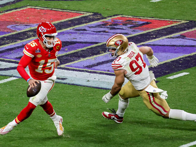 LAS VEGAS, NEVADA - FEBRUARY 11: Quarterback Patrick Mahomes #15 of the Kansas City Chiefs looks to throw under pressure from defensive end Nick Bosa #97 of the San Francisco 49ers in the fourth quarter of Super Bowl LVIII at Allegiant Stadium on February 11, 2024 in Las Vegas, Nevada. The Chiefs defeated the 49ers 25-22 in overtime.