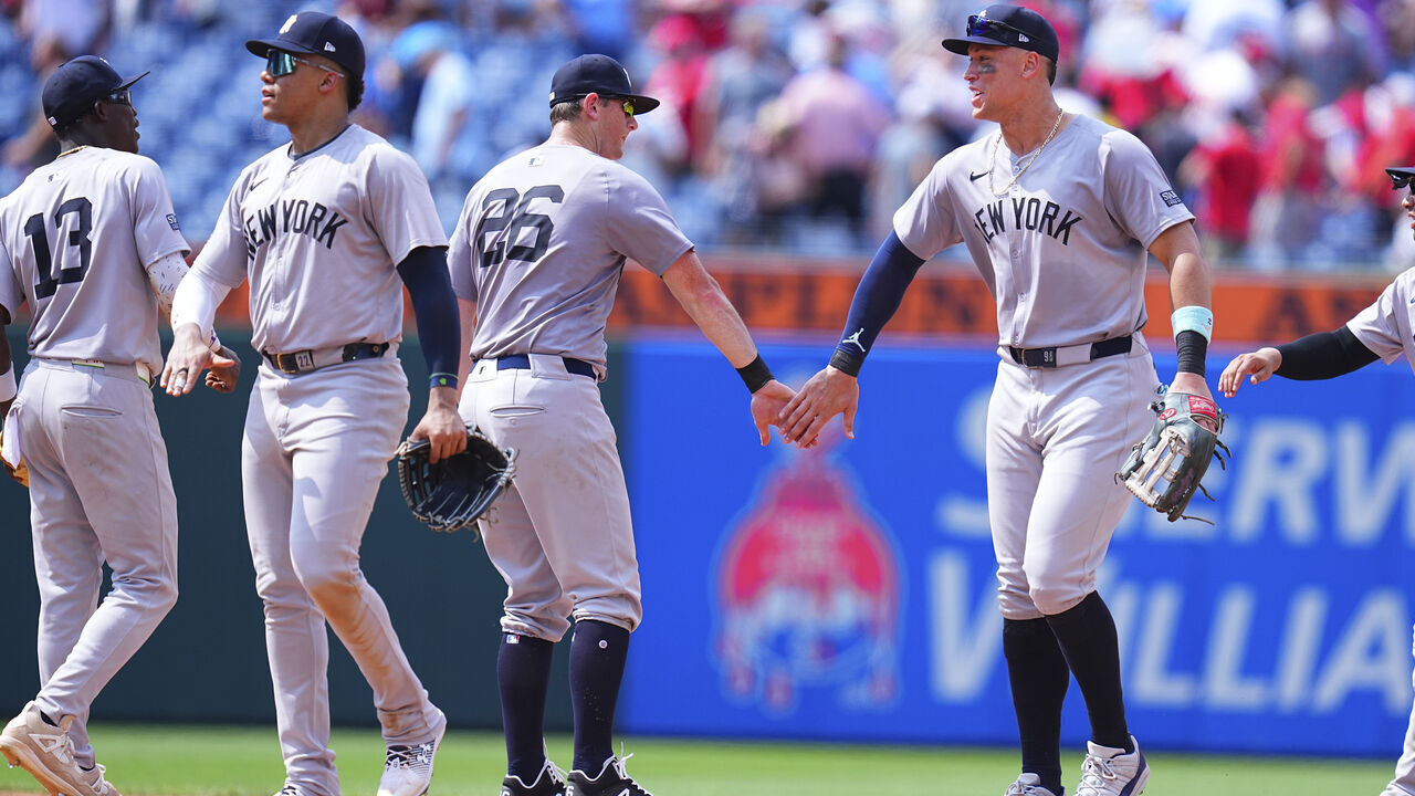 PHILADELPHIA, PENNSYLVANIA - JULY 31: Jazz Chisholm Jr. #13, Juan Soto #22, DJ LeMahieu #26, and Aaron Judge #99 of the New York Yankees celebrate their win against the Philadelphia Phillies at Citizens Bank Park on July 31, 2024 in Philadelphia, Pennsylvania. The Yankees defeated the Phillies 6-5.