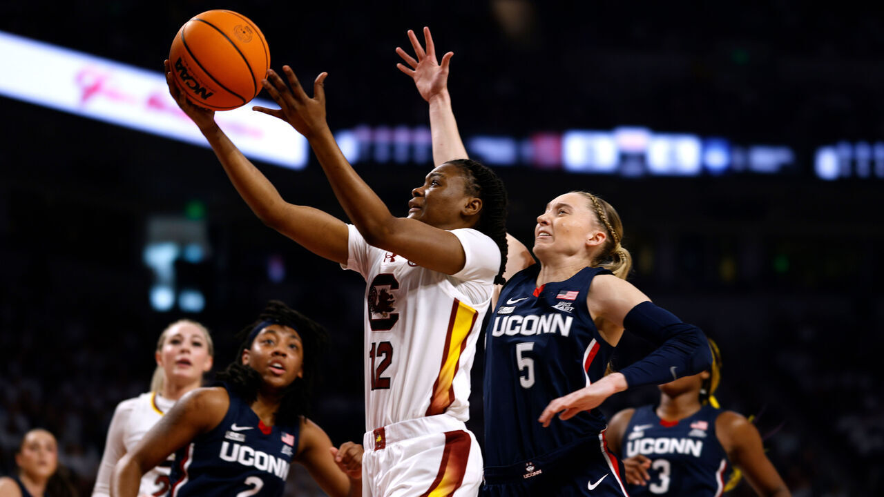 COLUMBIA, SOUTH CAROLINA - FEBRUARY 11: MiLaysia Fulwiley #12 of the South Carolina Gamecocks goes to the basket against Paige Bueckers #5 of the UConn Huskies at Colonial Life Arena on February 11, 2024 in Columbia, South Carolina. SC won 83-65.