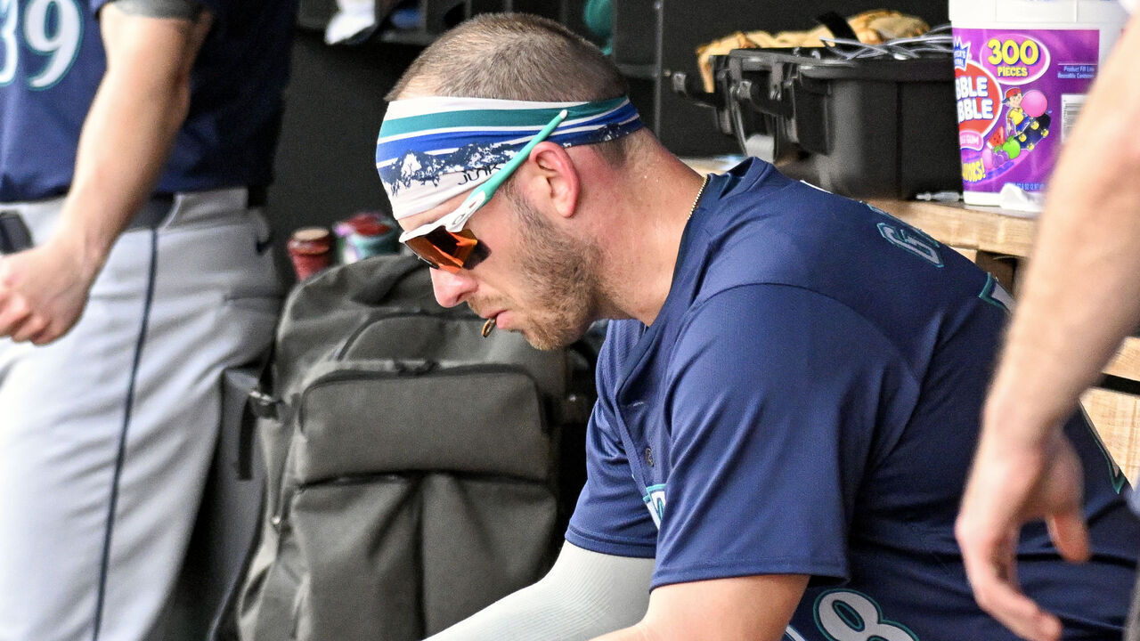 WASHINGTON, DC - May 26: Seattle Mariners designated hitter Mitch Garver (18) looks at a computer during the Seattle Mariners versus the Washington Nationals on May 26, 2024 at Nationals Park in Washington, D.C.